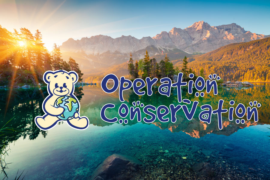 A picturesque mountain range with blue text that says "operation conservation" with The Bear Factory bear logo over it