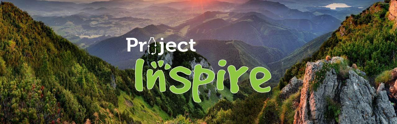 A sunset over a mountain range with the words "Project Inspire"