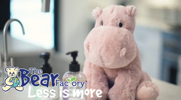 Hippo plush with The Bear Factory logo and text that says "less is more"